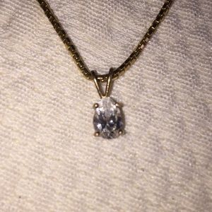 Pear shaped diamond solitaire in 14k gold setting